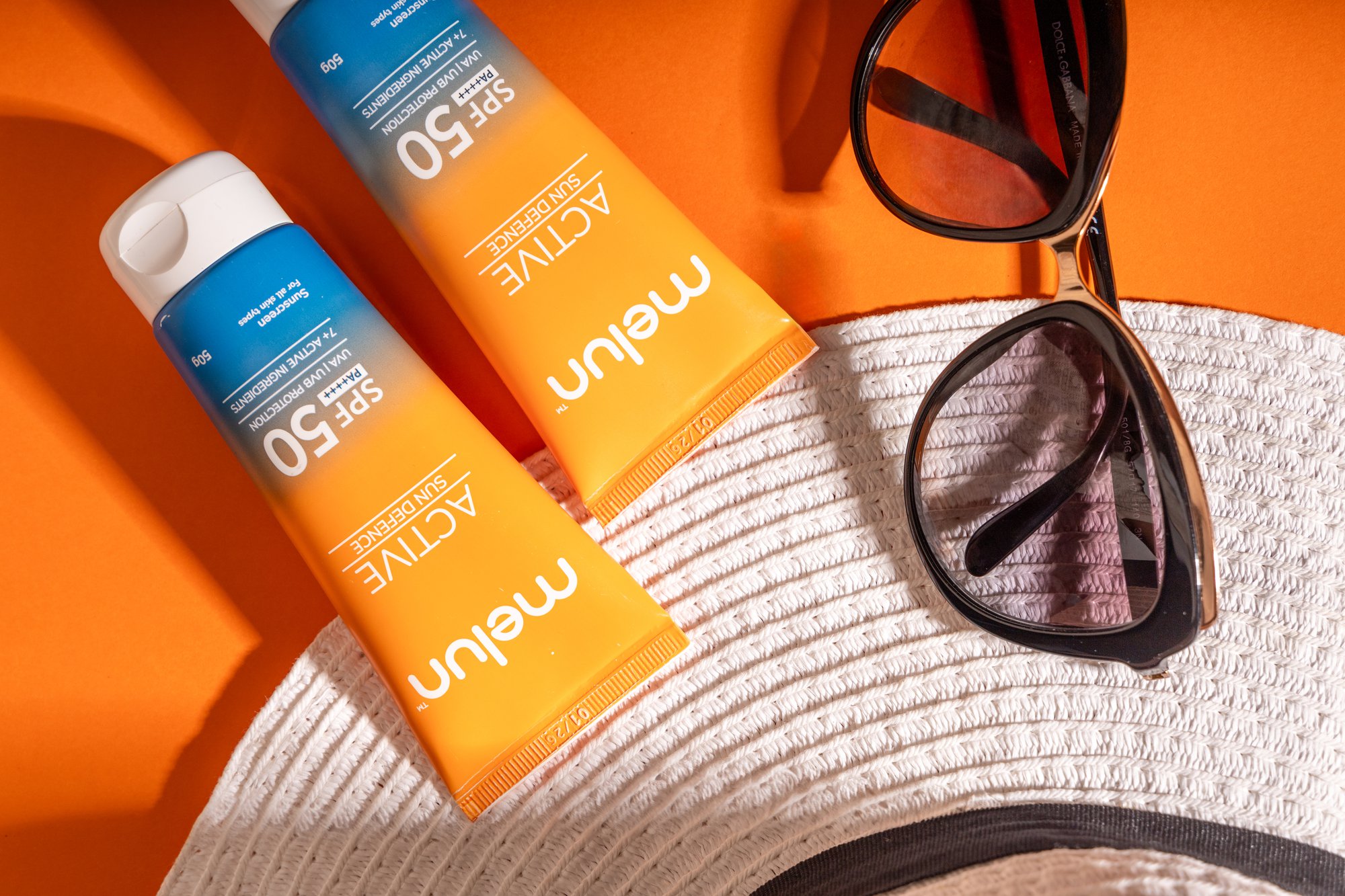 Two skincare products and a sunglass staged together for Product Photoshoot in Mumbai
